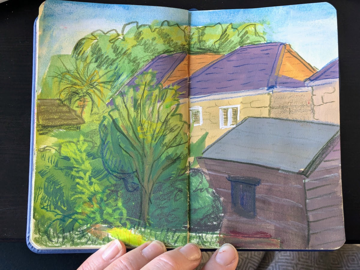 Sunset view of rooftops and a garden, painted in gouache